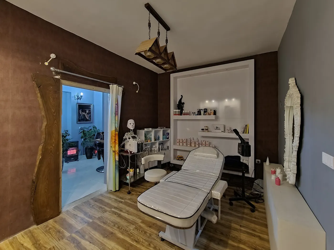 A barbershop interior with a barber chair and mirror