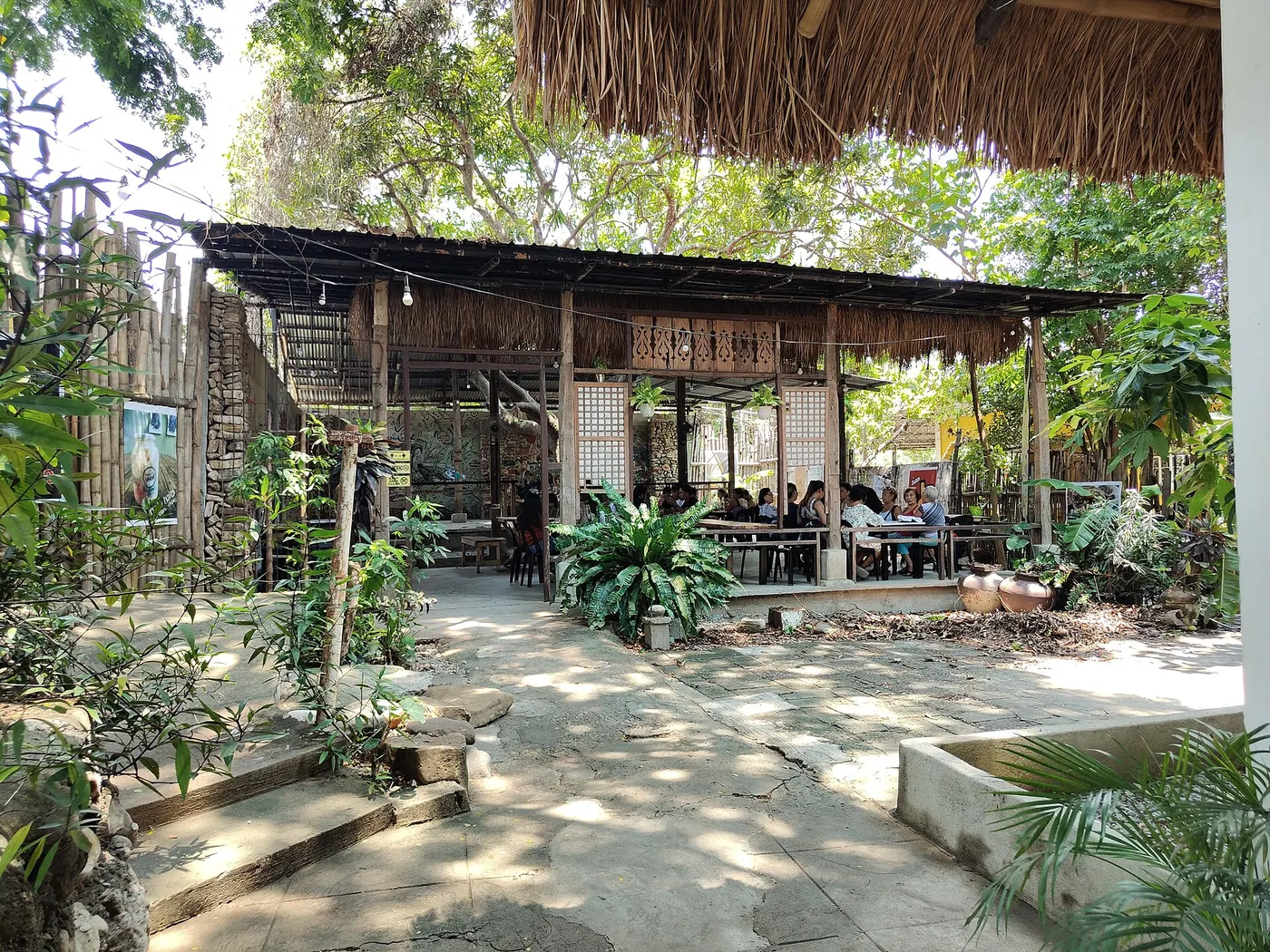 A garden café with tables under the trees