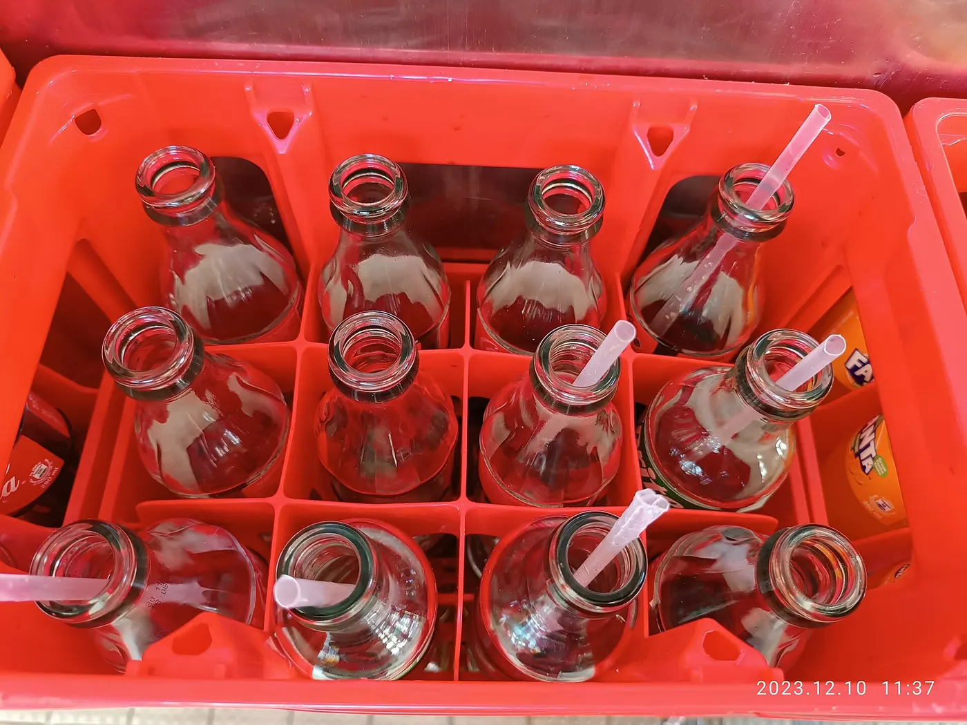 Glass bottles in a red crate