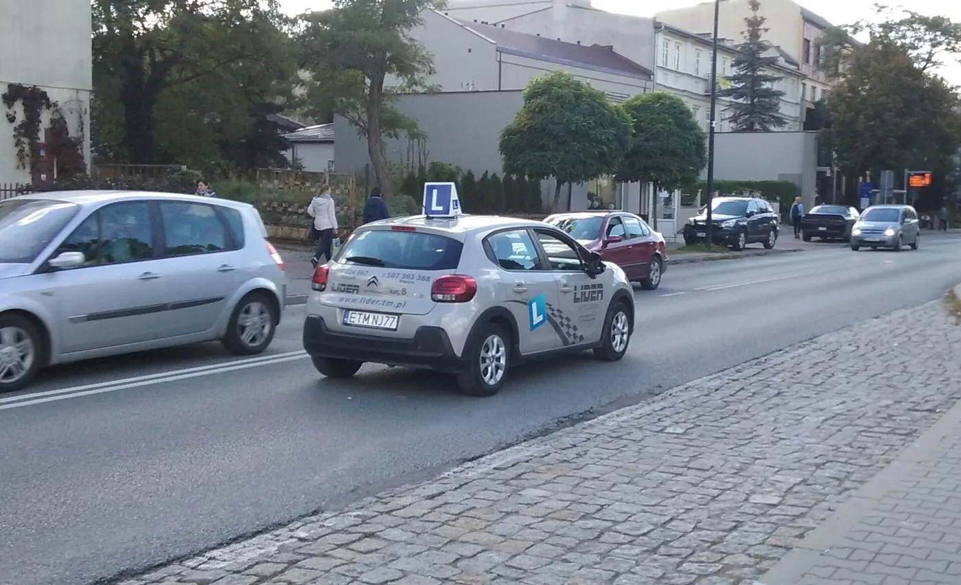 A driving school car on the road