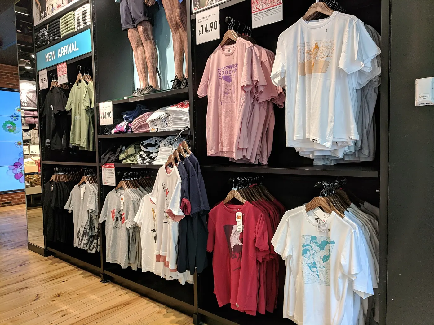 Racks of printed t-shirts in a clothing store