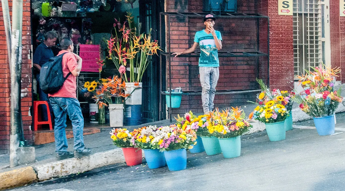 Buckets of flowers outside a florist