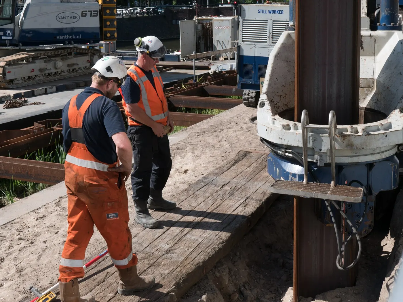 Construction workers in high-visibility gear on site