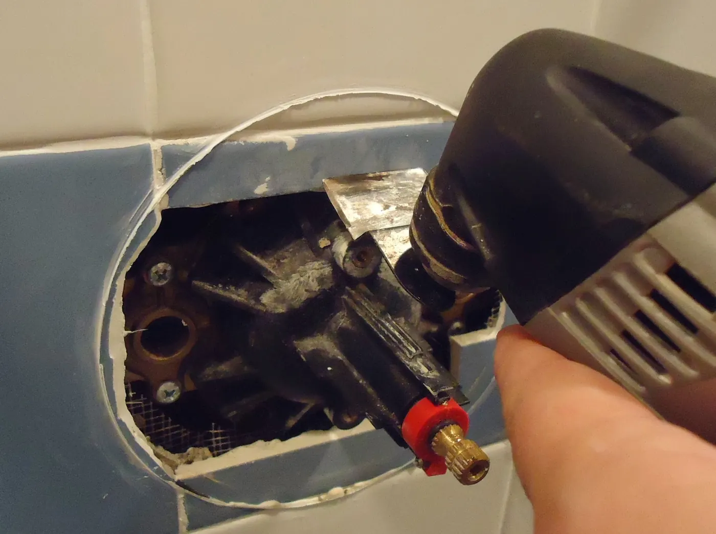 A power tool being used for a repair job