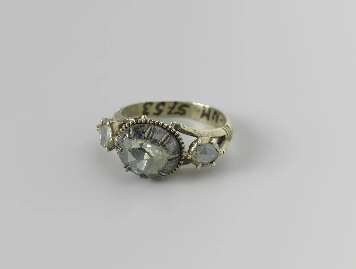 A gold ring set with a stone, photographed close up