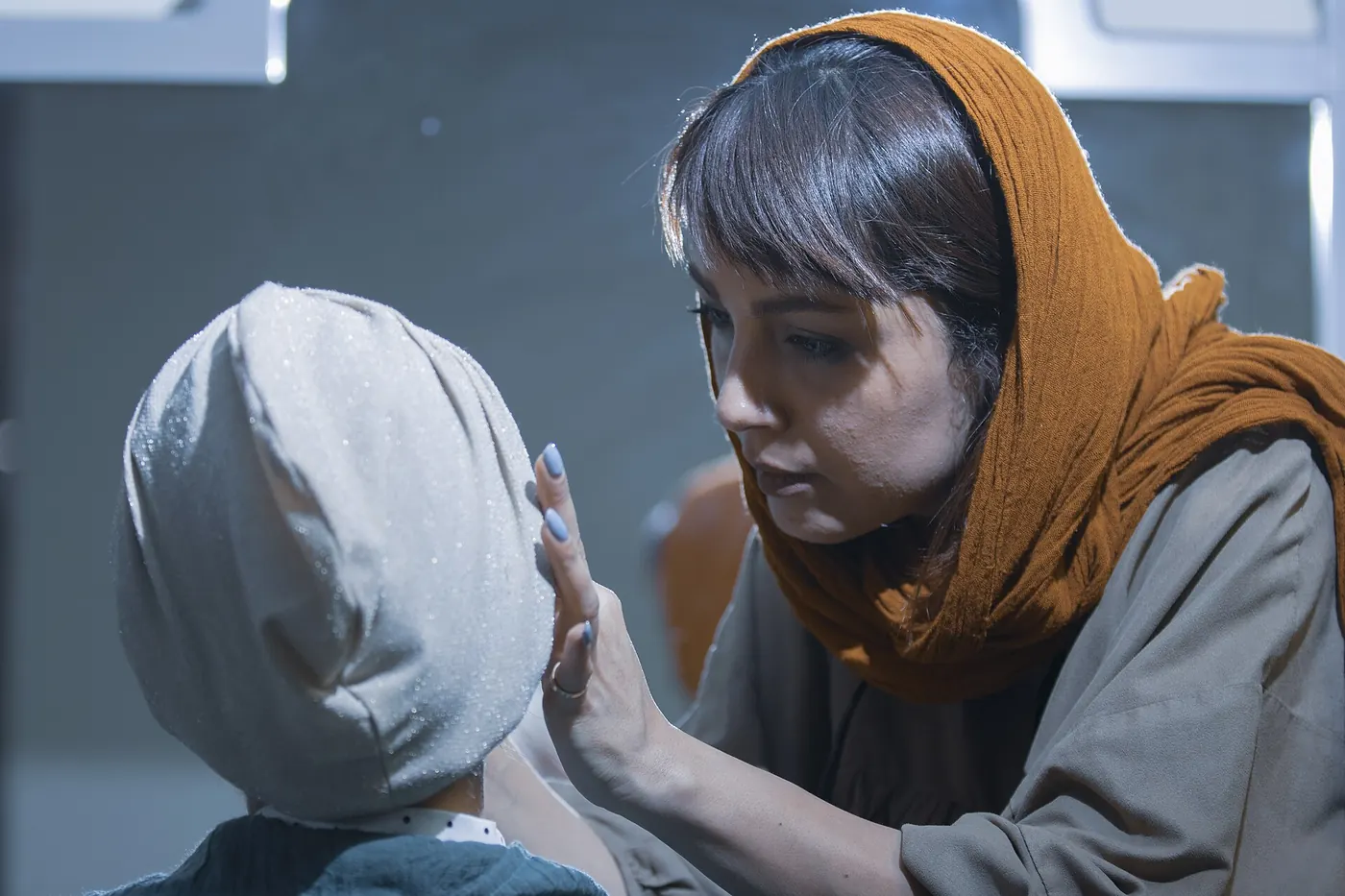 A makeup artist applying makeup to a client