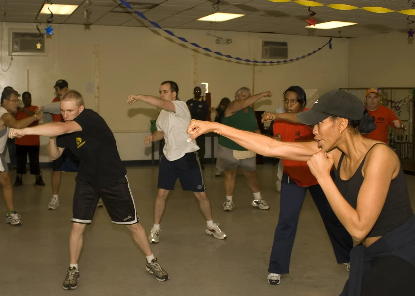 A trainer leading a group fitness class