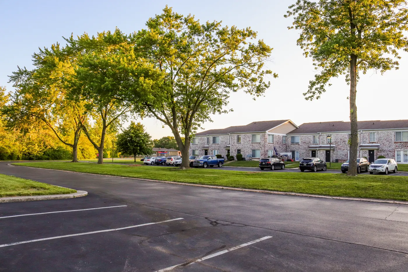 Apartment blocks around a tree-lined lawn