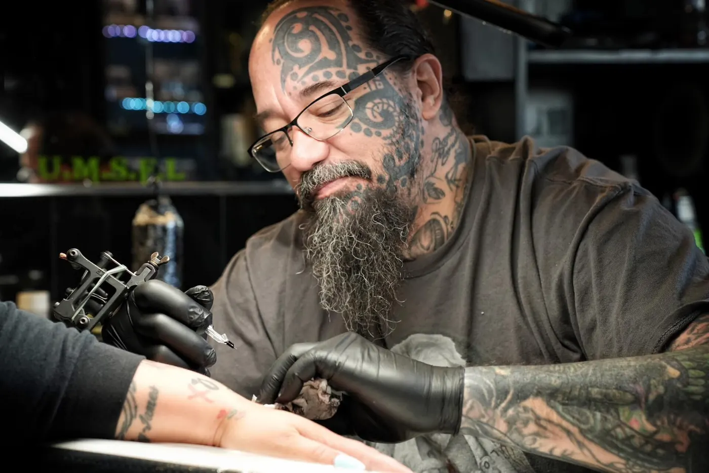 A tattoo artist at work in the studio