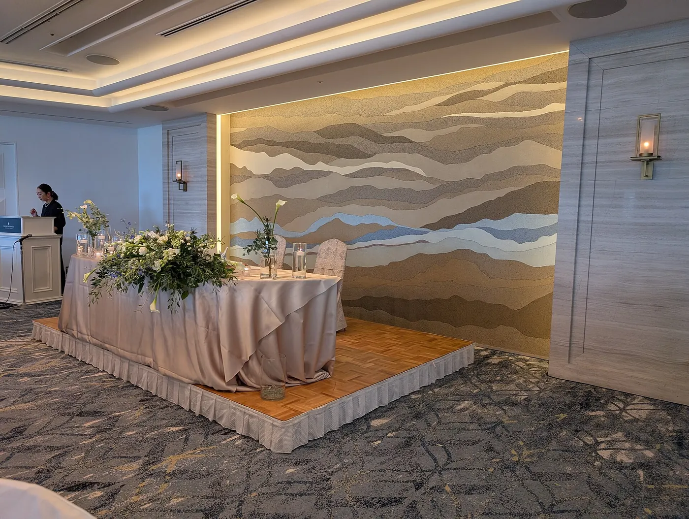 A wedding reception table dressed with flowers