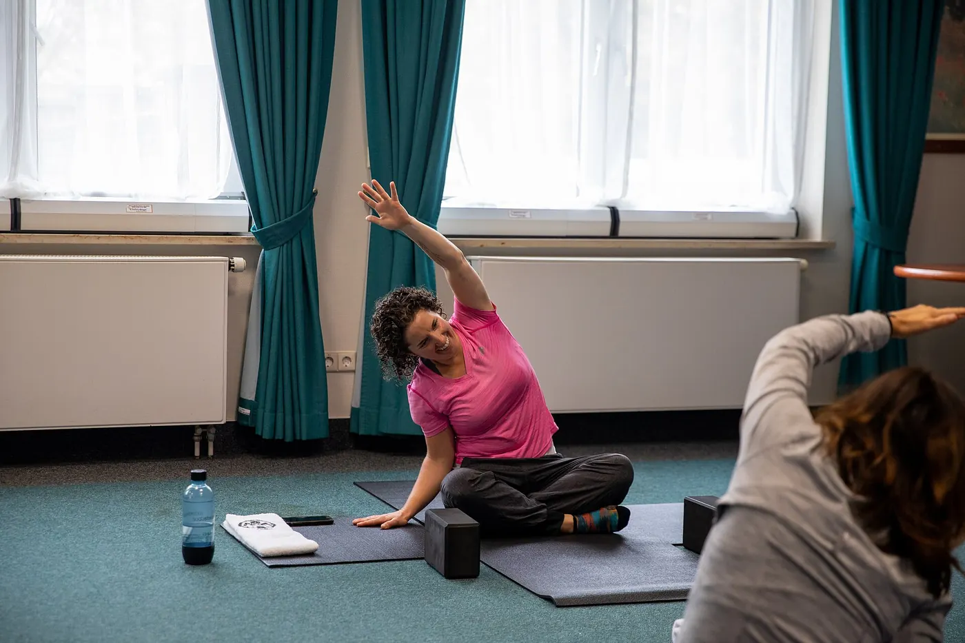 A woman stretching in a yoga class