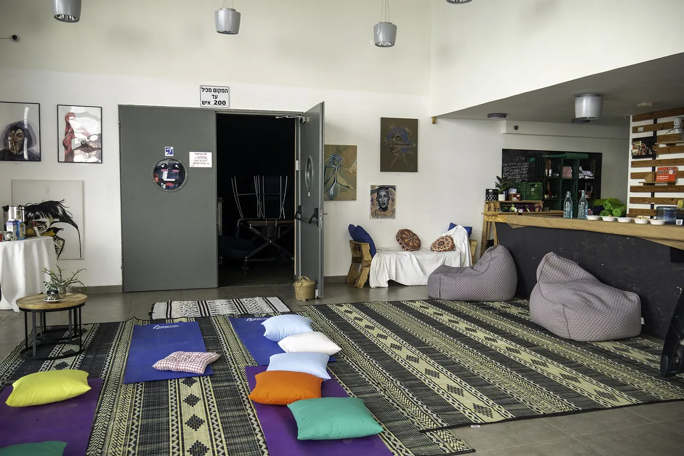 A yoga studio laid out with mats and cushions